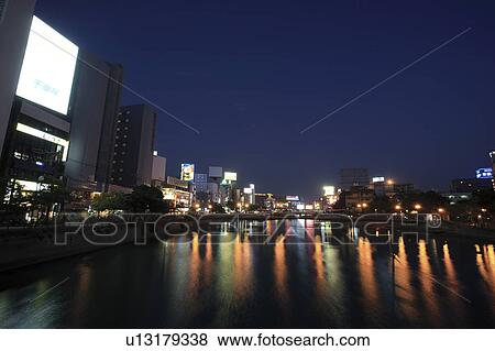 Stock Photo - Cityscape of Fukuoka city from Nishi Ohashi bridge at night, Fukuoka Prefecture, Kyushu, Japan. Fotosearch