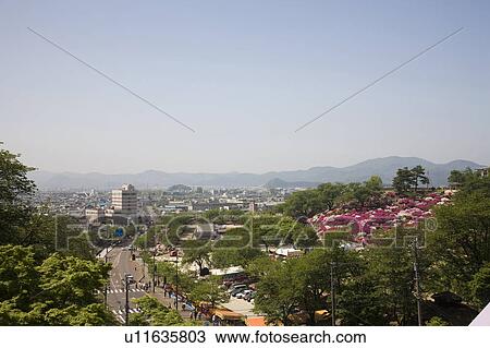 Stock Image - Cityscape of Sabae city and Nishiyama park, Fukui Prefecture, Honshu, Japan. Fotosearch