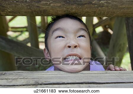 Close-up of a boy making a face, Japan View Large Photo Image Stock Image - Close-up of a boy making a face, Japan. Fotosearch