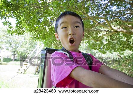Close-up of a boy making a face, Japan View Large Photo Image Stock Image - Close-up of a boy making a face, Japan. Fotosearch