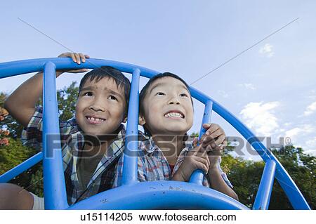 Stock Photography - Close-up of a boys making a face, Japan. Fotosearch