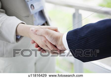 Stock Photo - Close up of Handshake. Fotosearch