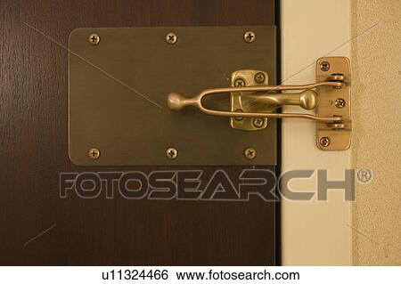 Close Up Of Latch On Hotel Door Stock Photograph U11324466
