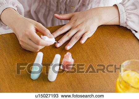 Close up of Woman Doing her Nails View Large Photo Image Stock Image - Close up of Woman Doing her Nails. Fotosearch