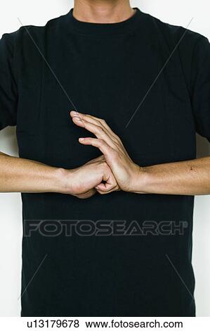 Stock Photo - Close up of Young Man Holding Fist to His Hand. Fotosearch
