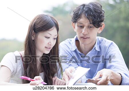 College students studying together View Large Photo Image Stock Photograph - College students studying together. Fotosearch