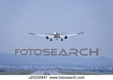 Commercial airplane landing, Hokkaido Prefecture, Japan View Large Photo Image Stock Photo - Commercial airplane landing, Hokkaido Prefecture, Japan. Fotosearch