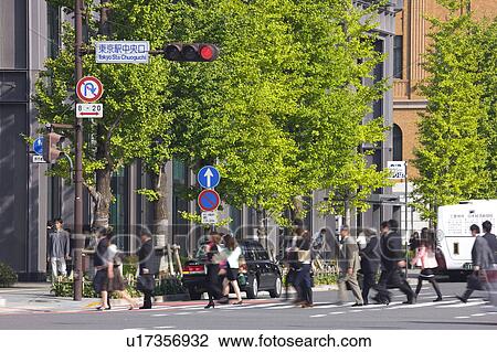 Stock Image - Commuters at Marunouchi, Chiyoda Ward, Tokyo Prefecture, Honshu, Japan. Fotosearch