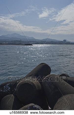 Stock Photo - Concrete Blocks at Waterfront. Fotosearch