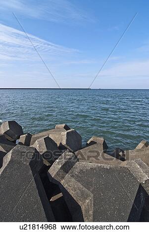 Stock Photo - Concrete Blocks on Beach. Fotosearch