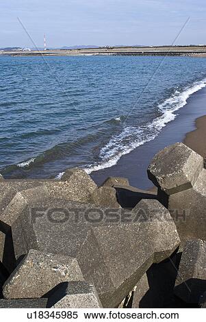 Stock Photography - Concrete Blocks on Beach. Fotosearch