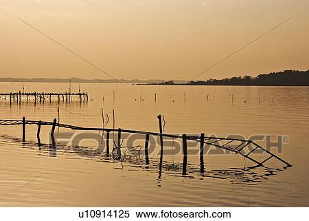 Stock Photography - Decayed Footbridge in Lake. Fotosearch