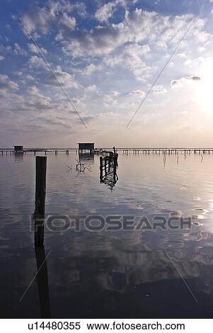 Stock Photography - Decayed Footbridge in Lake. Fotosearch
