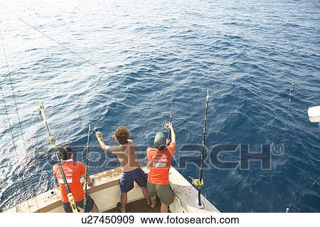 Stock Photo - Fishermen on boat, Tokyo prefecture, Japan. Fotosearch