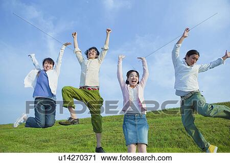Four Young Women and Men Jumping of Joy View Large Photo Image Stock Image - Four Young Women and Men Jumping of Joy. Fotosearch