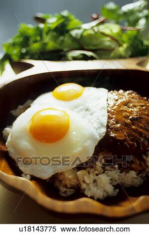 Fried eggs on hamburger steak View Large Photo Image Stock Photography - Fried eggs on hamburger steak. Fotosearch