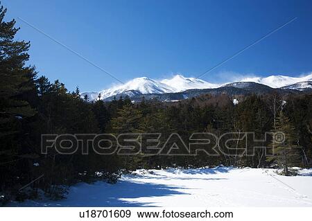 Frozen Pond and Snowcapped Mountains in the Background View Large Photo Image Stock Photo - Frozen Pond and Snowcapped Mountains in the Background. Fotosearch