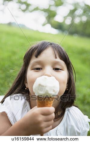 Picture - Girl Eating Ice Cream. Fotosearch