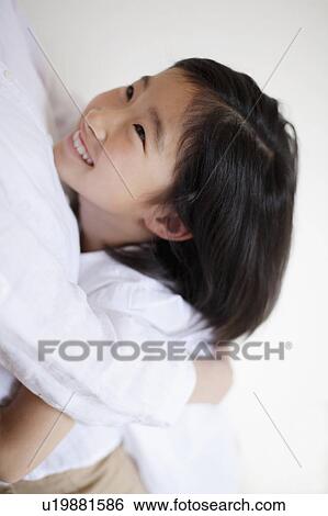 Girl Hugging her Mother View Large Photo Image Stock Photograph - Girl Hugging her Mother. Fotosearch