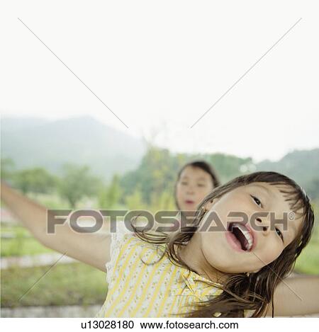Girl Laughing and Bending Sideways View Large Photo Image Stock Image - Girl Laughing and Bending Sideways. Fotosearch