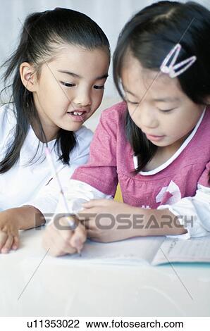 Girls doing homework, Japan View Large Photo Image Stock Image - Girls doing homework, Japan. Fotosearch