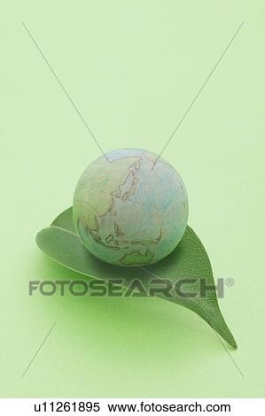Stock Photography - Globe on Green Leaf. Fotosearch