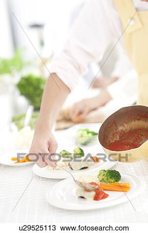 Hands setting meal View Large Photo Image Stock Image - Hands setting meal. Fotosearch