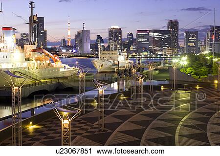 Stock Image - Harumi Terminal Port and Tokyo Tower at dusk, Chuo Ward, Tokyo Prefecture, Honshu, Japan. Fotosearch
