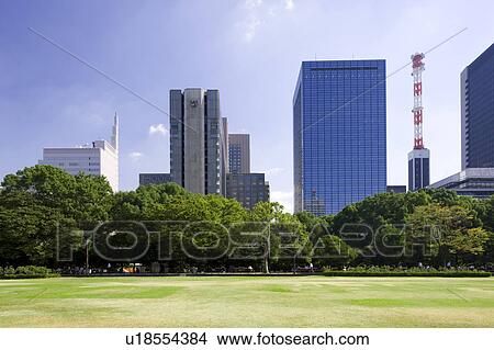 Hibiya park and skyline of Marunouchi, Chiyoda Ward, Tokyo Prefecture, Honshu, Japan View Large Photo Image Picture - Hibiya park and skyline of Marunouchi, Chiyoda Ward, Tokyo Prefecture, Honshu, Japan. Fotosearch
