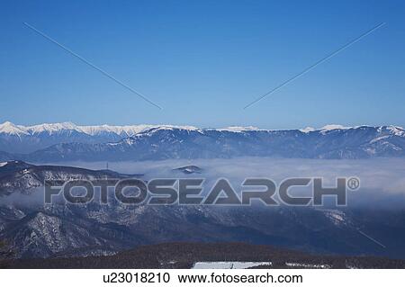 Stock Image - Hida mountains and cloudscape, Nagano Prefecture, Honshu, Japan. Fotosearch