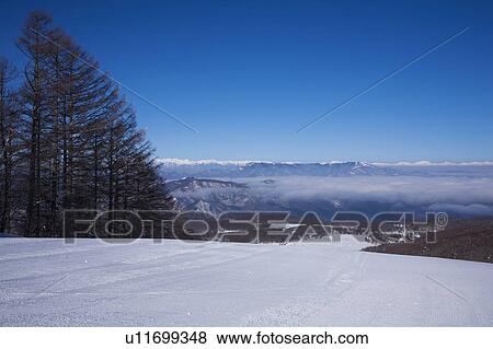 Stock Photo - Hida mountains and cloudscape, Nagano Prefecture, Honshu, Japan. Fotosearch