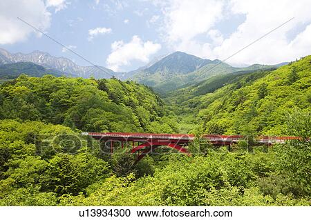 Stock Image - Higashizawa bridge and Yatsugatake mountains, Yamanashi Prefecture, Honshu, Japan. Fotosearch