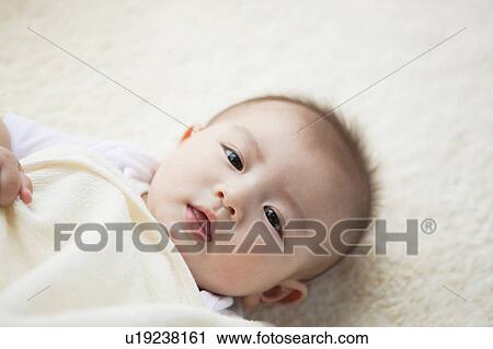 High Angle View of Baby Boy Lying on Back View Large Photo Image Stock Image - High Angle View of Baby Boy Lying on Back. Fotosearch