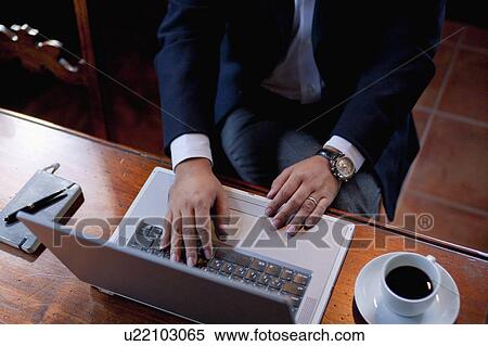 High Angle View of Man Using Laptop View Large Photo Image Stock Photography - High Angle View of Man Using Laptop. Fotosearch
