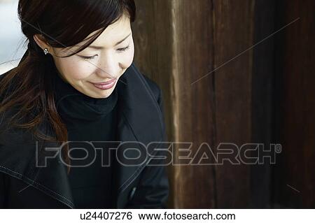 Stock Photograph - High Angle View of Woman Smiling. Fotosearch