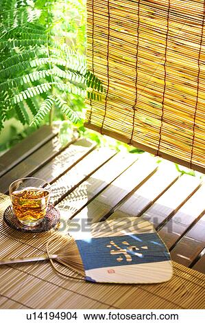 Picture - Ice tea and fan at veranda, Kanagawa Prefecture, Honshu, Japan. Fotosearch