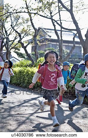 Kids running home from elementary school, Japan View Large Photo Image Stock Photograph - Kids running home from elementary school, Japan. Fotosearch