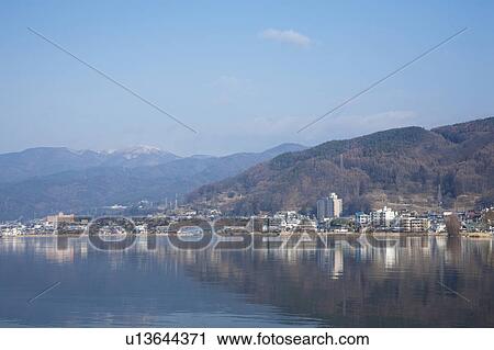 Stock Image - Lake Suwa and Cityscape of Suwa city, Nagano Prefecture, Honshu, Japan. Fotosearch