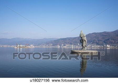 Stock Photograph - Lake Suwa and statue of Princess Yaegaki, Nagano Prefecture, Honshu, Japan. Fotosearch