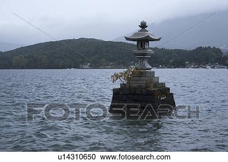 Stock Image - Lantern at Ugajinja Shrine in Nojiri Lake. Fotosearch