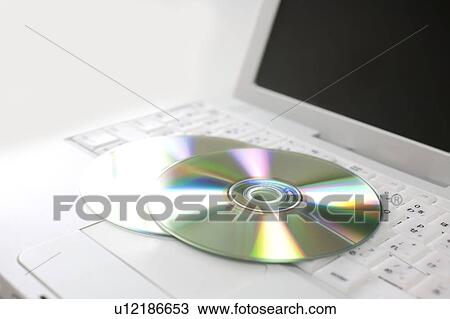 Stock Image - Laptop and CDs. Fotosearch