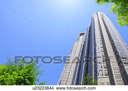 Picture - Low angle of Tall Building and Blue Sky. Fotosearch