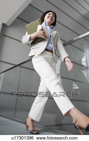 Low Angle View of Businesswoman Walking View Large Photo Image Stock Photograph - Low Angle View of Businesswoman Walking. Fotosearch