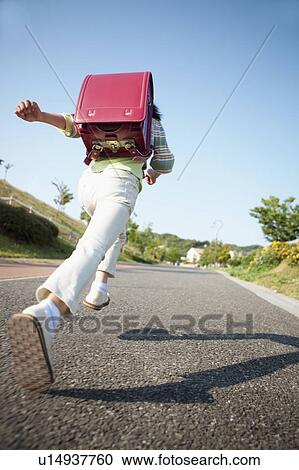 Low Angle View of Schoolgirl Running on Road View Large Photo Image Stock Image - Low Angle View of Schoolgirl Running on Road. Fotosearch