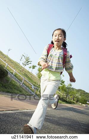 Low Angle View of Schoolgirl Running on Road View Large Photo Image Stock Image - Low Angle View of Schoolgirl Running on Road. Fotosearch