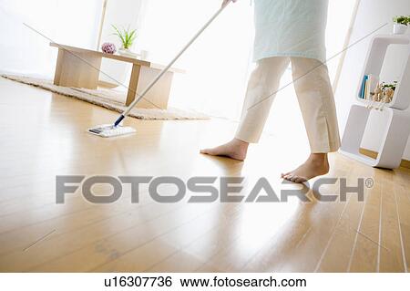 Low Section of Woman Wiping Floor View Large Photo Image Stock Photograph - Low Section of Woman Wiping Floor. Fotosearch