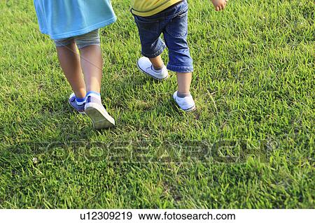 Low Section View of Boy and Girl Walking View Large Photo Image Stock Photo - Low Section View of Boy and Girl Walking. Fotosearch