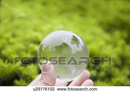 Man holding globe, Kanagawa Prefecture, Honshu, Japan View Large Photo Image Stock Image - Man holding globe, Kanagawa Prefecture, Honshu, Japan. Fotosearch