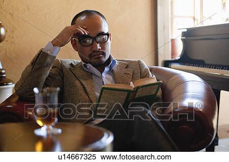 Mature Man Reading Book in Leather Armchair View Large Photo Image Stock Photography - Mature Man Reading Book in Leather Armchair. Fotosearch