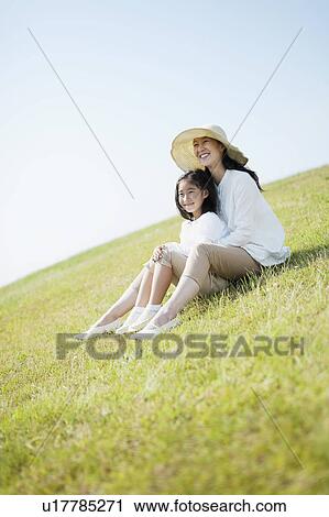 Mother and Daughter Sitting in Field View Large Photo Image Stock Image - Mother and Daughter Sitting in Field. Fotosearch